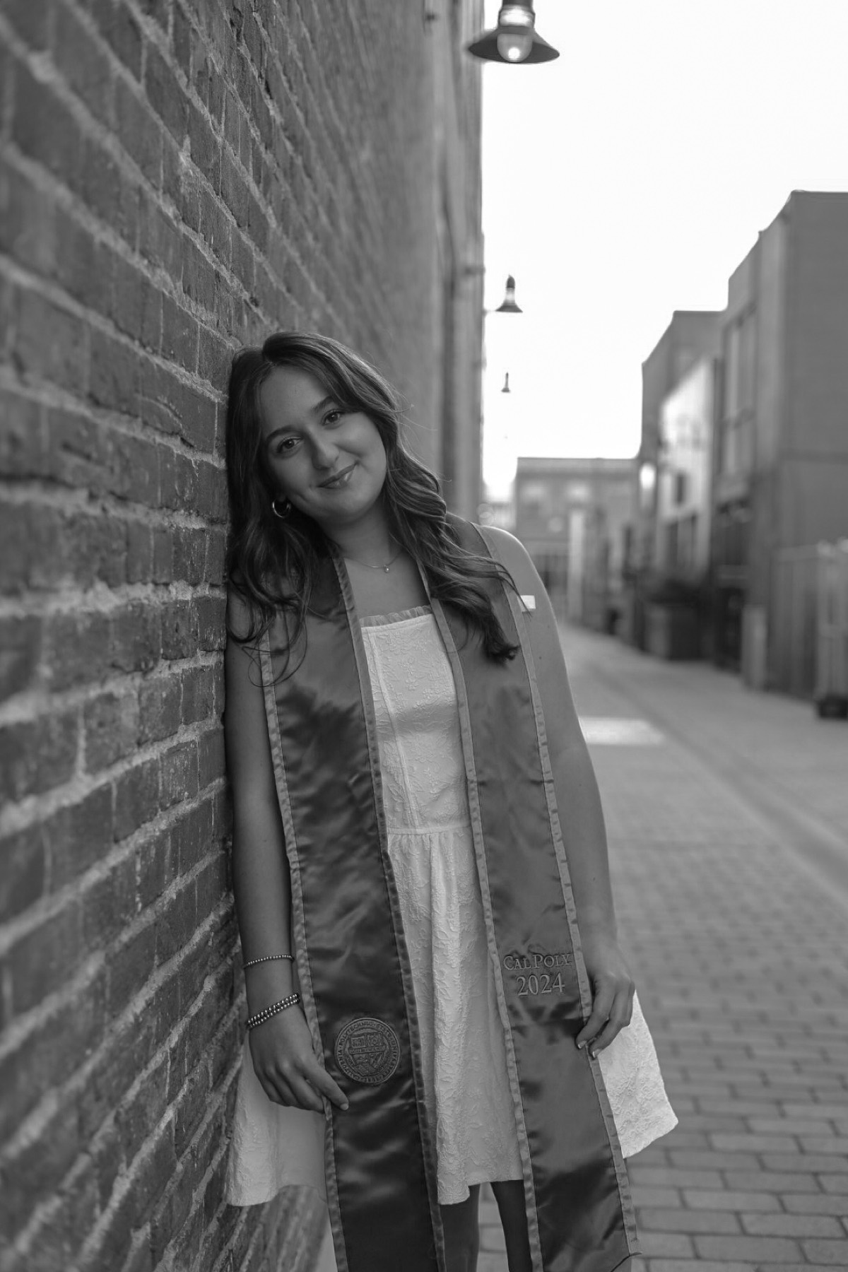 Black and white portrait against a wall